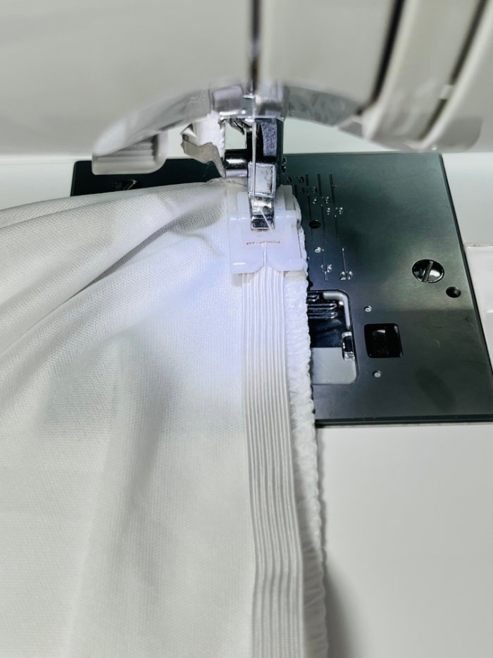 How to Fix Loose Elastic on a Waterproof Mattress Protector (Easy DIY Repair) Securing elastic to mattress protector with wide zigzag stitch