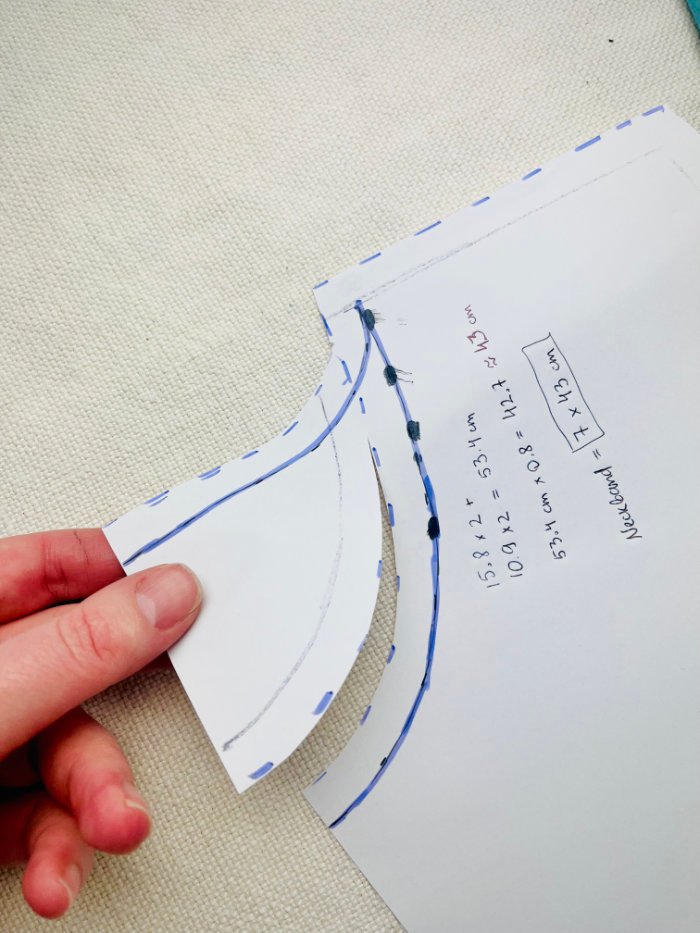 Adjustment to the pattern piece before tracing and cutting front bodice pieces for a women’s fitted T-shirt from knit fabric