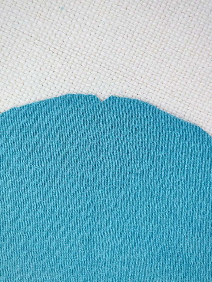 Marking notches on T-shirt pattern pieces for accurate sewing alignment