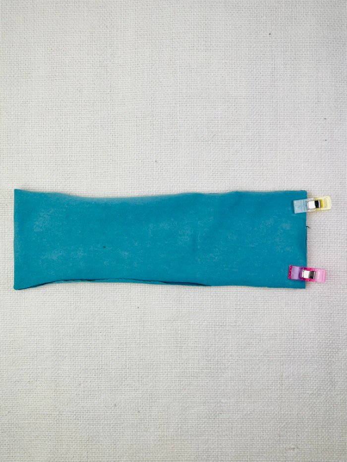 Pinning the knit neckband for a fitted T-shirt neckline