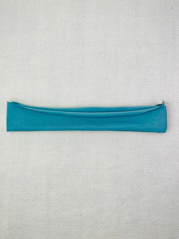 Folding the neckband in half