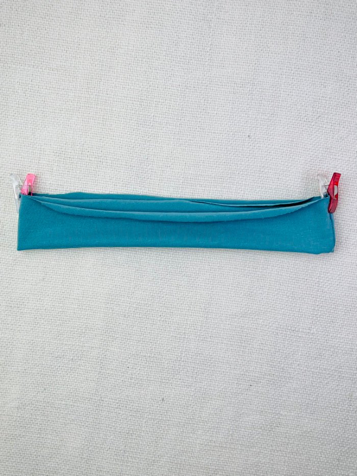 Pinning the neckband to mark centre front and centra back