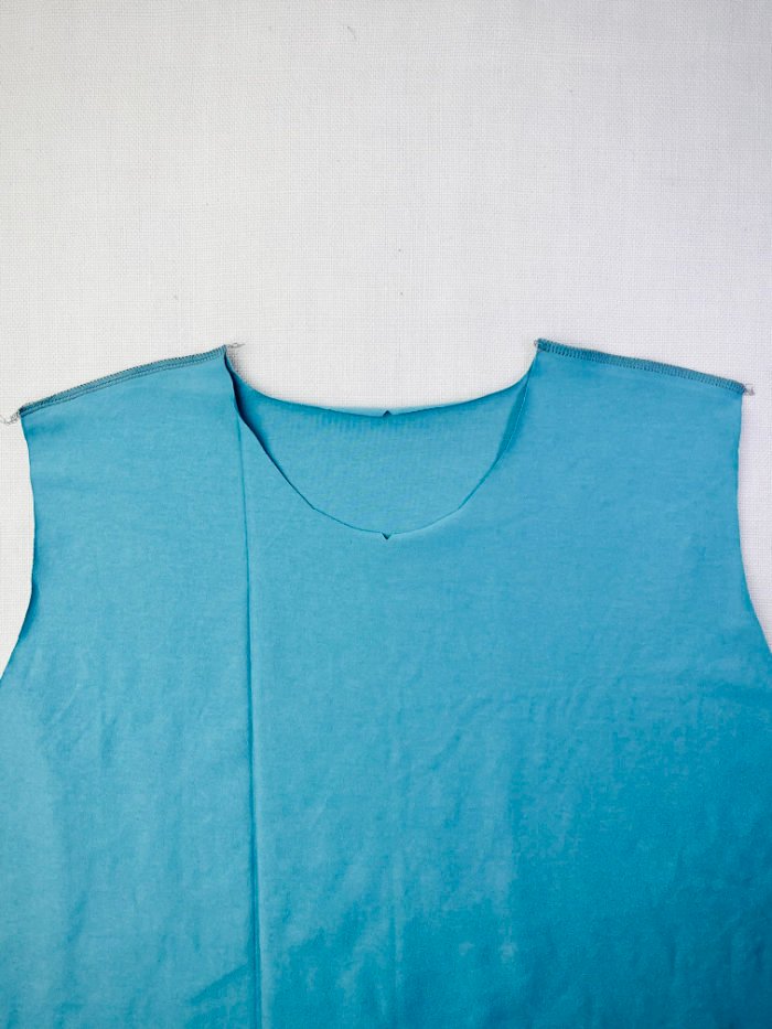 Sewn and pressed shoulder seams on a women’s fitted T-shirt 