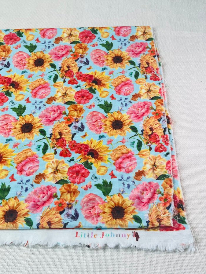 How to Sew a Hair Scrunchie: 4 Easy Methods Using Less Fabric (Beginner-Friendly) Folding fabric selvedge to selvedge to cut low-waste strips for sewing hair scrunchies