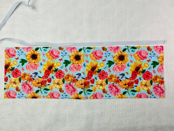 How to Sew a Hair Scrunchie: 4 Easy Methods Using Less Fabric (Beginner-Friendly) Measuring elastic length for a hair scrunchie by stretching it against fabric strip