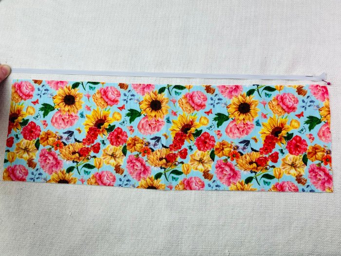 How to Sew a Hair Scrunchie: 4 Easy Methods Using Less Fabric (Beginner-Friendly) Measuring elastic length for a hair scrunchie by stretching it against fabric strip