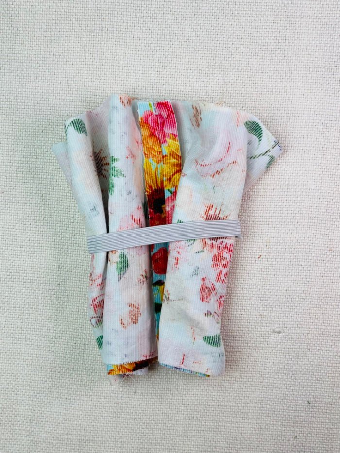 How to Sew a Hair Scrunchie: 4 Easy Methods Using Less Fabric (Beginner-Friendly) Placing elastic over fabric loop when sewing a hair scrunchie