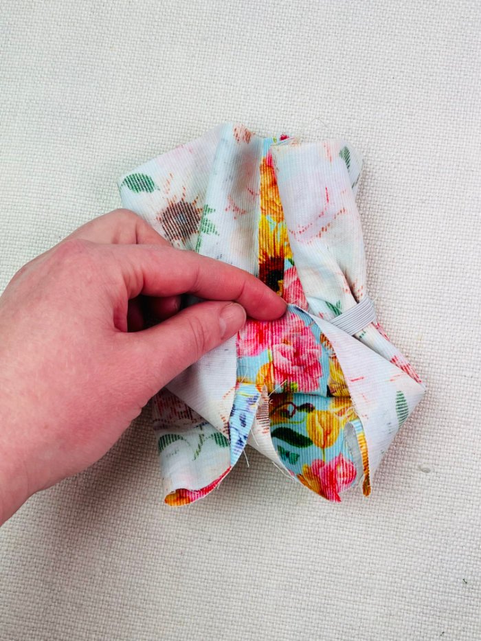 How to Sew a Hair Scrunchie: 4 Easy Methods Using Less Fabric (Beginner-Friendly) Folding fabric toward centre to prepare burrito method hair scrunchie