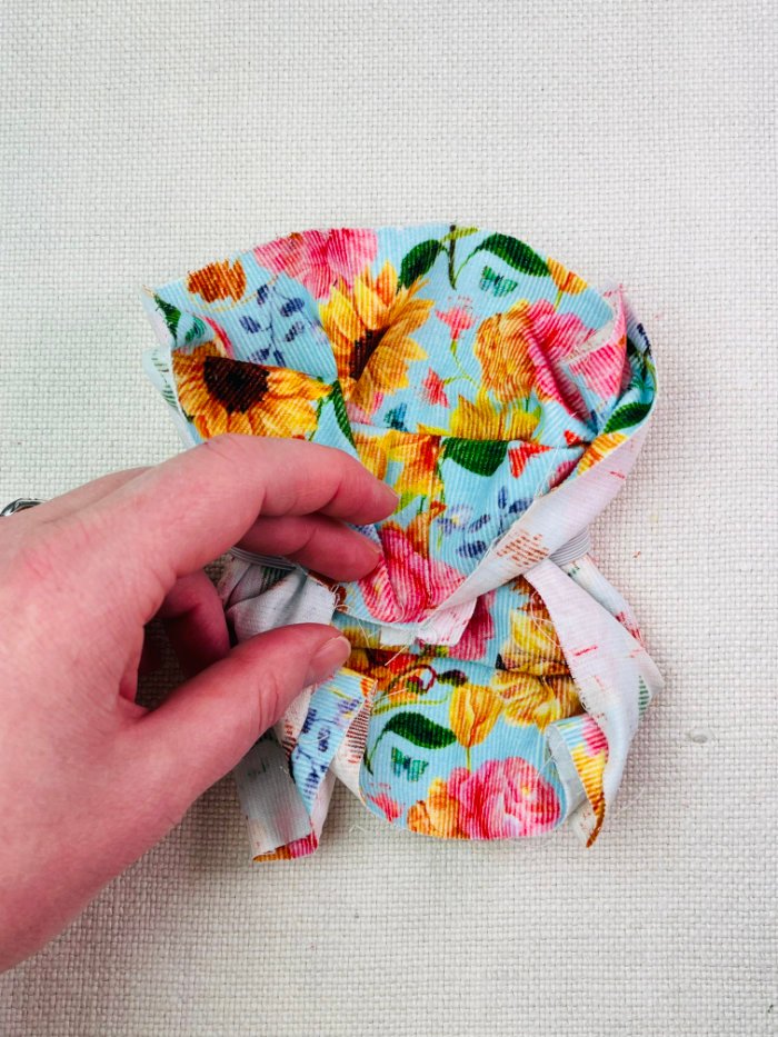 How to Sew a Hair Scrunchie: 4 Easy Methods Using Less Fabric (Beginner-Friendly) Folding fabric toward centre to prepare burrito method hair scrunchie