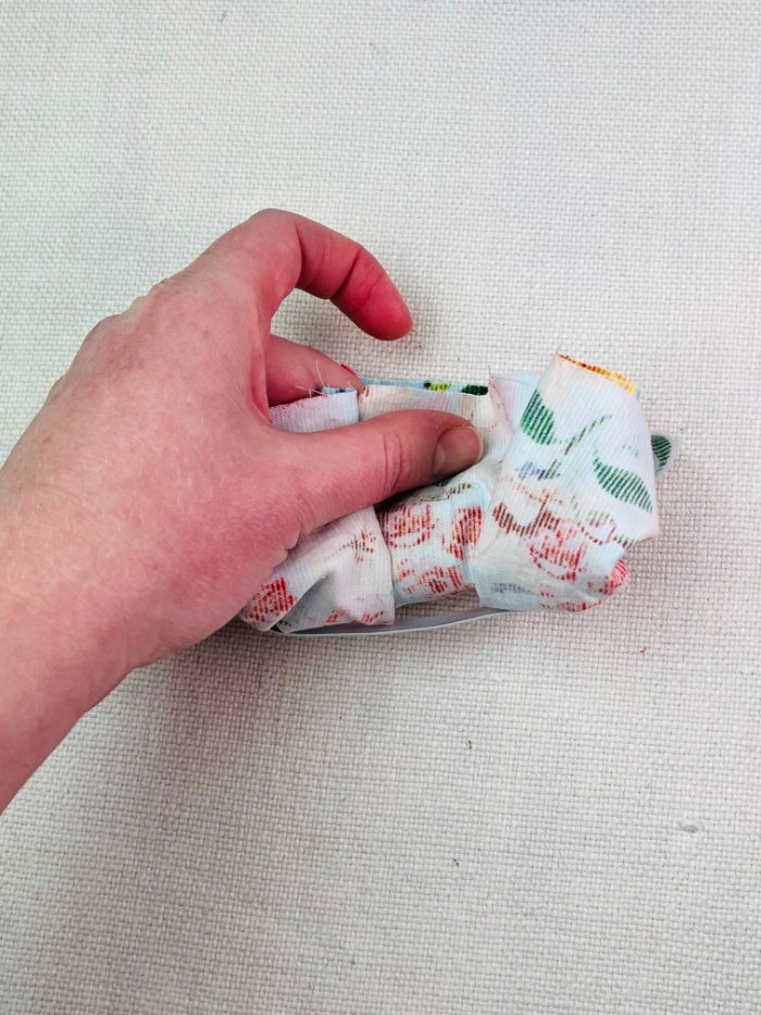 How to Sew a Hair Scrunchie: 4 Easy Methods Using Less Fabric (Beginner-Friendly) Enclosing folded fabric inside outer layer for burrito method scrunchie