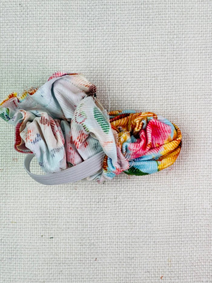 How to Sew a Hair Scrunchie: 4 Easy Methods Using Less Fabric (Beginner-Friendly) Turning burrito method hair scrunchie right side out through opening