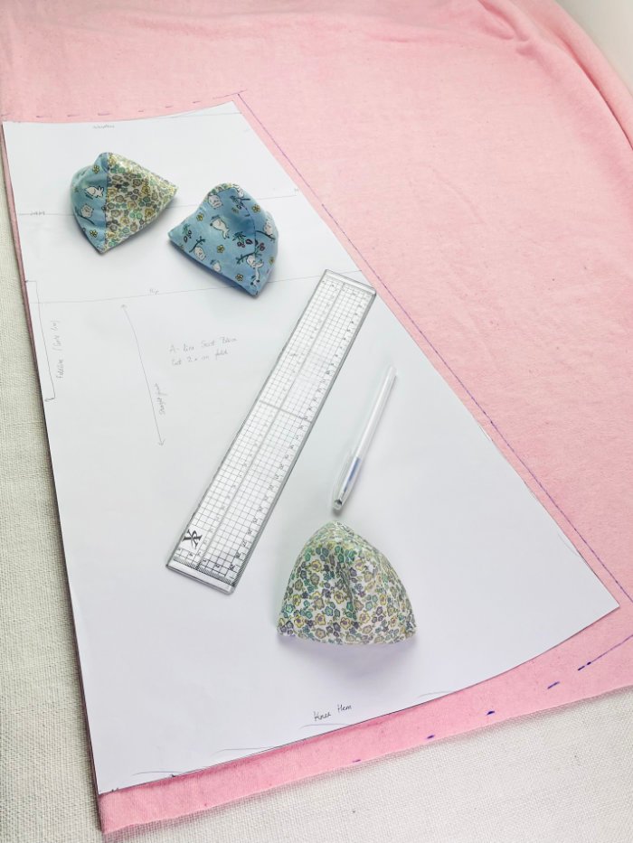 How to Sew a Wrap Skirt from an A-Line Skirt Block (Beginner) Cutting back skirt pattern piece on fabric fold