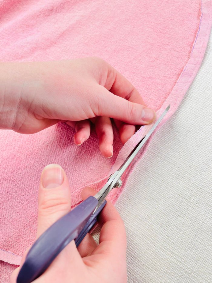 How to Sew a Wrap Skirt from an A-Line Skirt Block (Beginner) Trimming excess seam allowance close to stitch line when sewing rolled hem