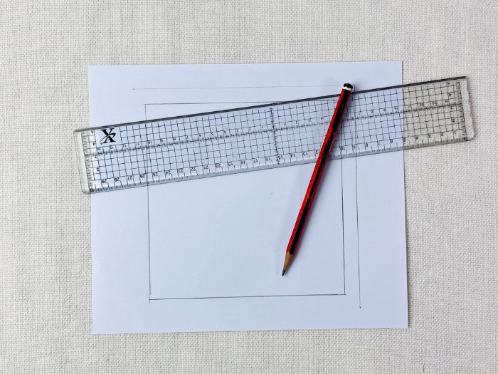 Sewing pattern with seam allowances added on paper, showing outer cutting line and original seam line