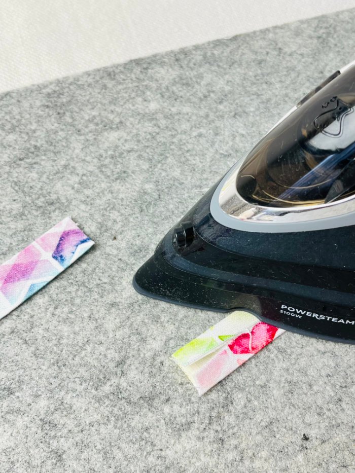 Preparing D-ring tab for adjustable shoulder strap