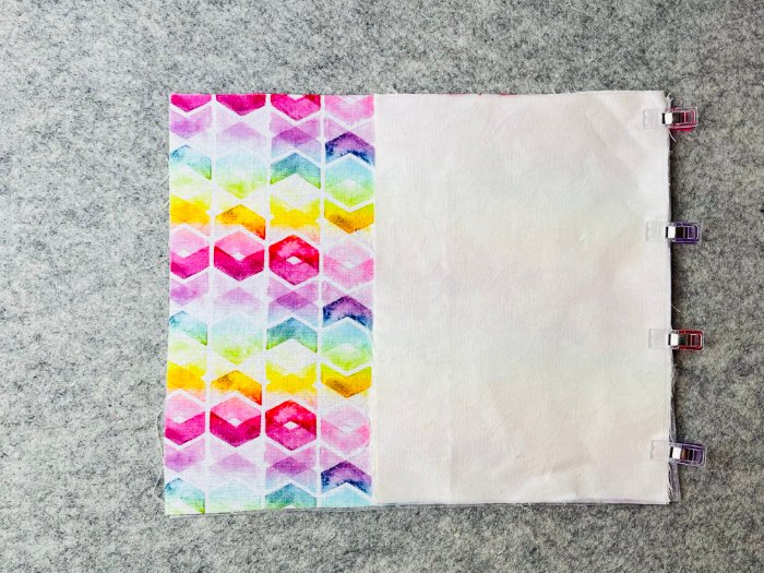 Joining two lower panels to create zipper pocket