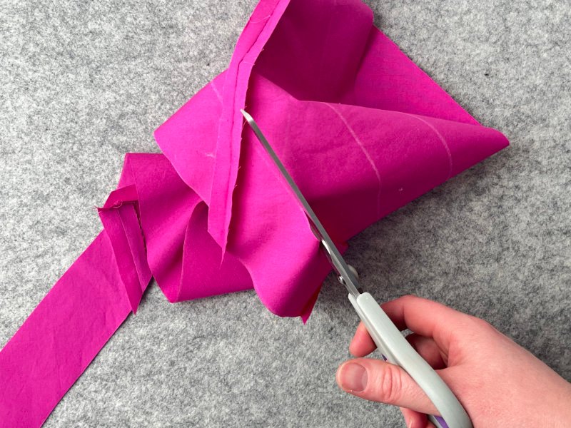 How to Make Bias Binding (Step-by-Step Tutorial for Beginners) Cutting long continuous bias strip along marked line after sewing tube method.