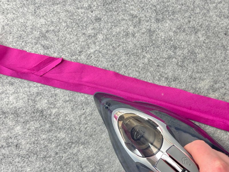 How to Make Bias Binding (Step-by-Step Tutorial for Beginners) Pressing one side to the centre crease line to create bias binding