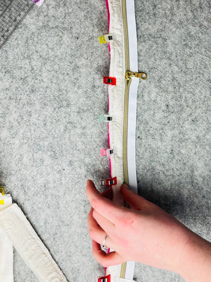 Turning lining and upper gusset piece to the right side before topstitching the zip