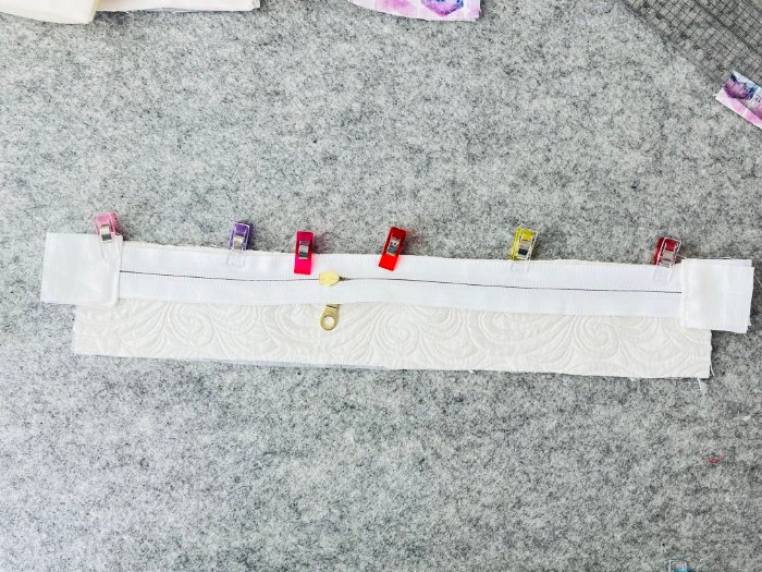 Pinning zipper onto exterior laptop bag panel