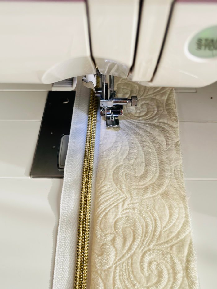 Topstitching zipper seam on padded laptop bag front