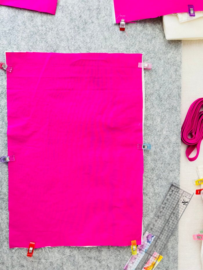 Basting lining to exterior zipper pocket panel