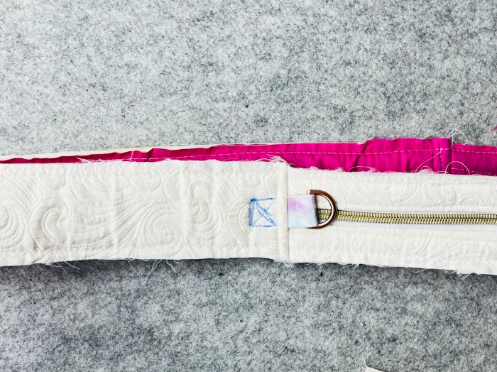 Reinforcing D-ring tabs