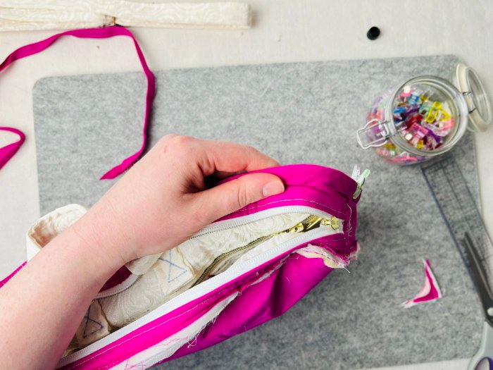 Folding bias binding to encase seam allowance