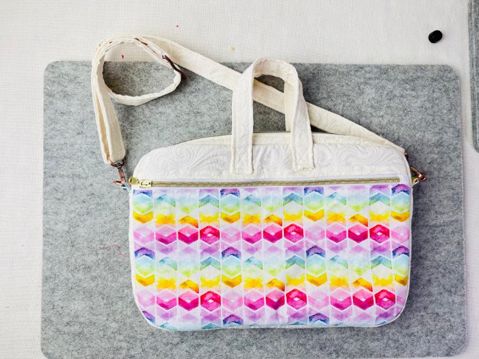 Finished adjustable shoulder strap attached to D-rings