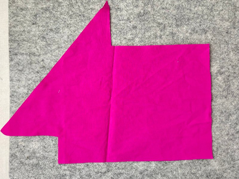 How to Make Bias Binding (Step-by-Step Tutorial for Beginners) Squaring woven cotton fabric along straight grain before cutting bias strips for DIY bias binding.