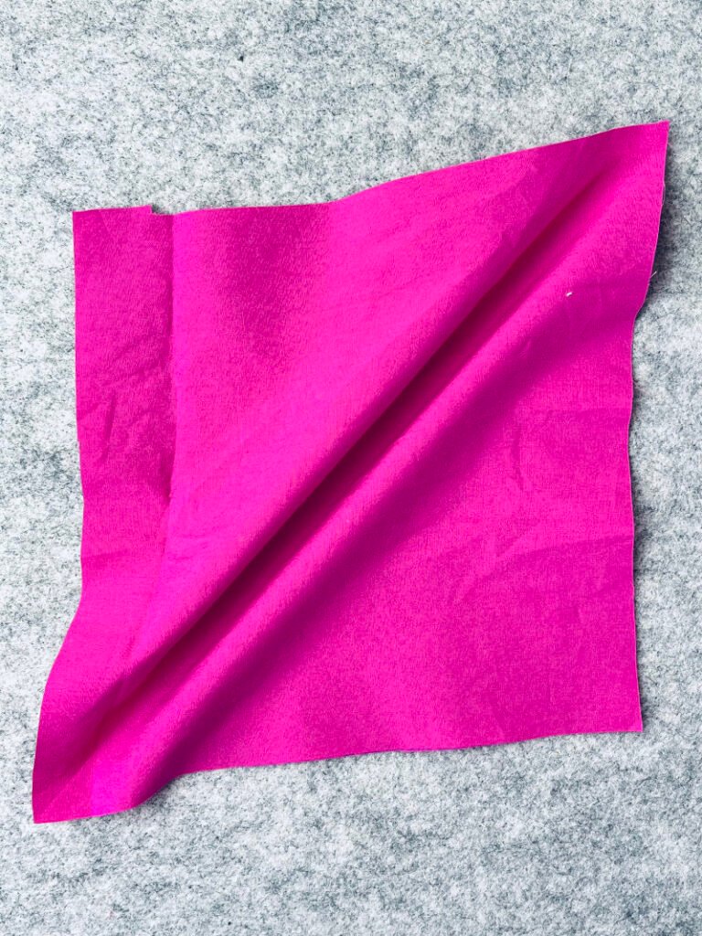 How to Make Bias Binding (Step-by-Step Tutorial for Beginners) Fabric pulled along its bias to show the stretch