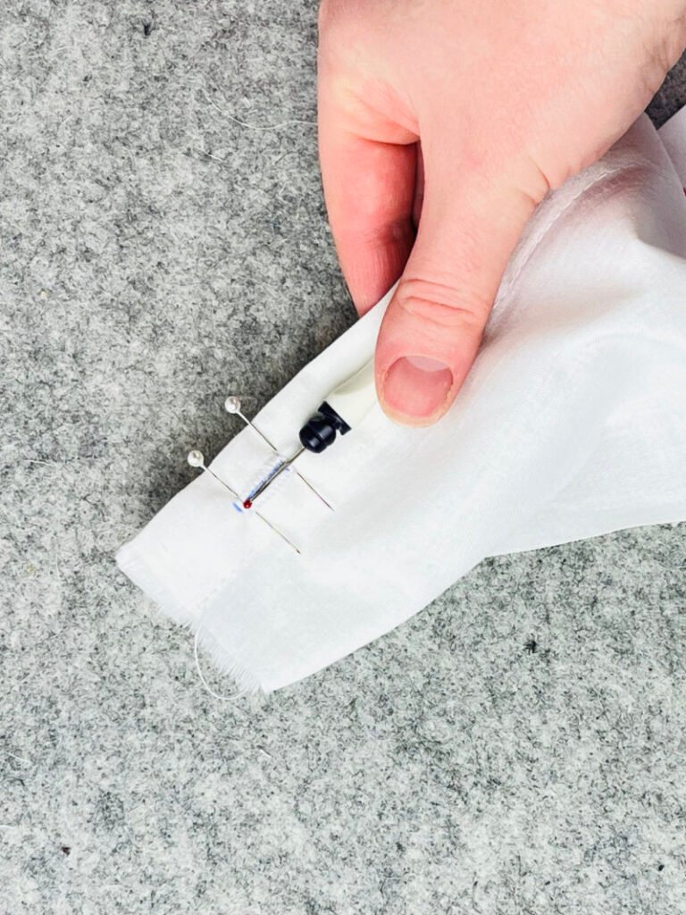 cutting open buttonhole with seam ripper safely