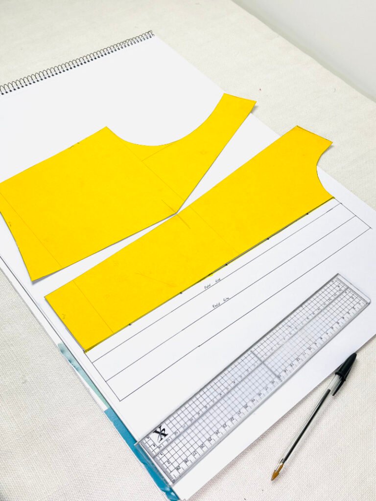 How to Draft a Button Stand (Step-by-Step Pattern Drafting Tutorial) Completed button stand pattern labelled with fold lines and seam allowance