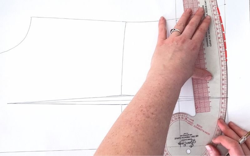 How to Modify a Basic Bodice Block for a Shirt Pattern (Step-by-Step) drawing back shirt hemline with smooth curve