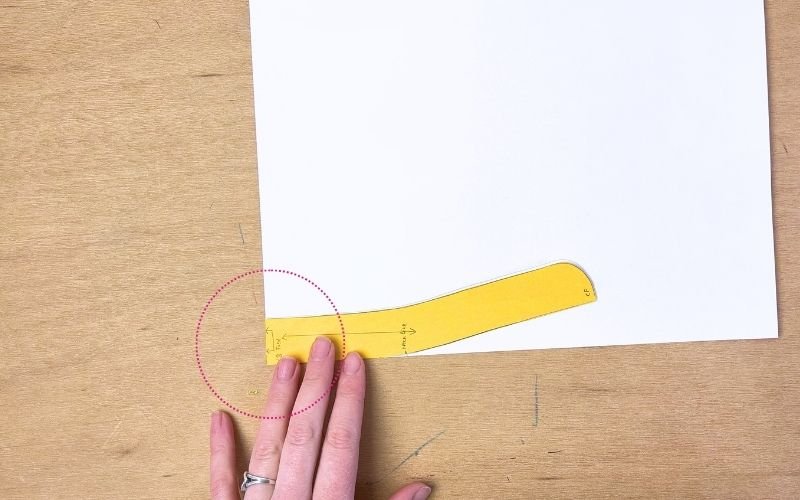 tracing collar stand seam line on pattern paper for shirt collar drafting