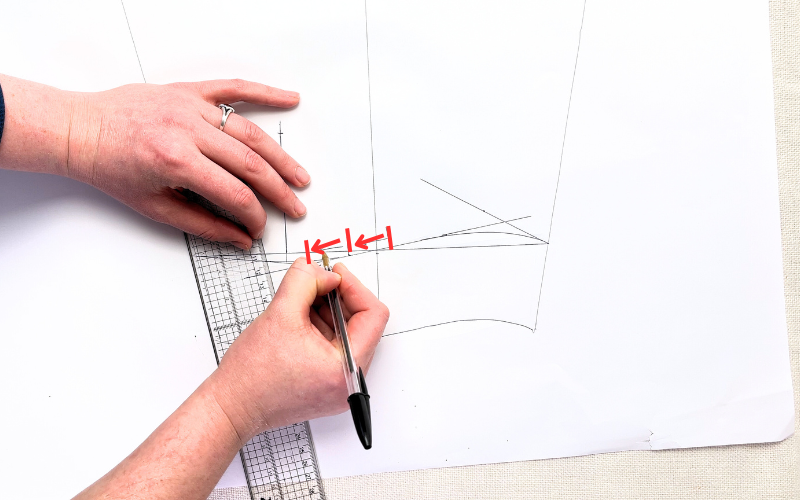Drafting pleat placement near sleeve slit to reduce sleeve opening width for a shirt cuff