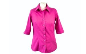 Finished shirt front with crisp grown-on button stand, evenly spaced buttons and clean topstitching for a professional shirt finish