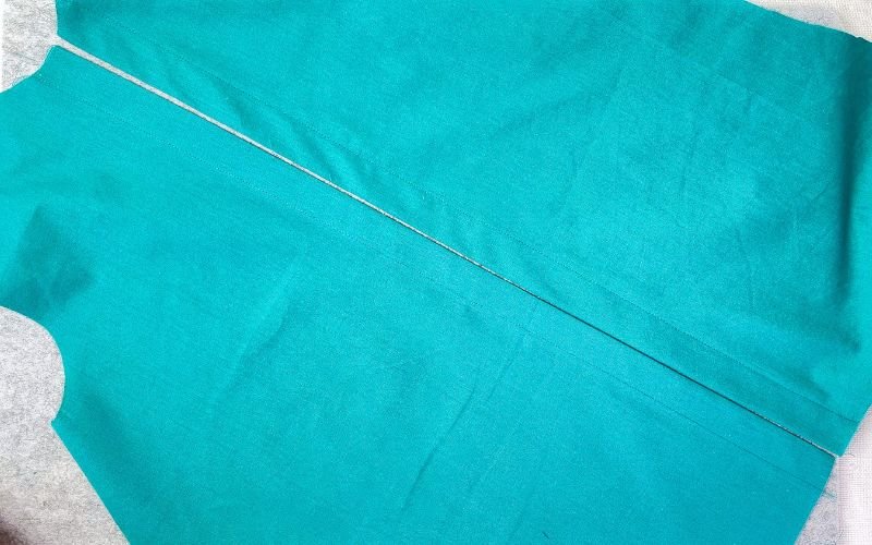 Difference between pressed and unpressed button stand after sewing