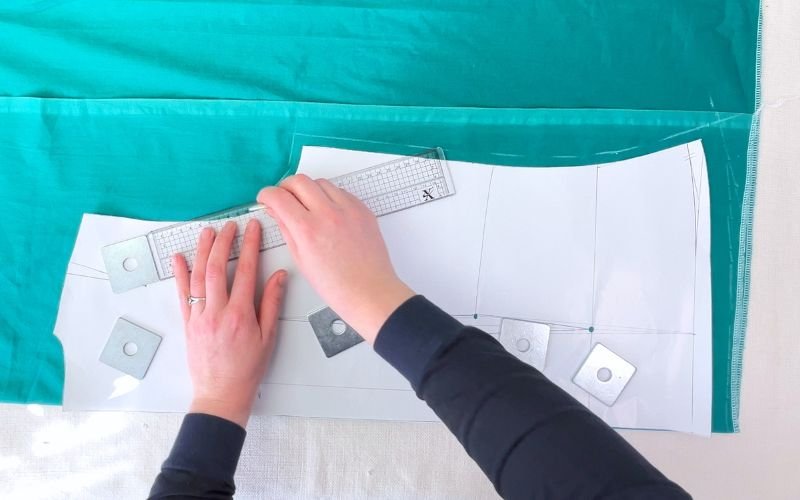 Tracing shirt front pattern with grown-on button stand onto fabric using pattern weights and ruler