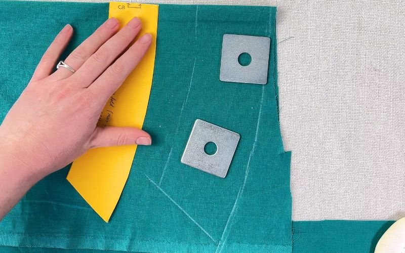 cutting shirt collar pieces on fabric fold following grainline
