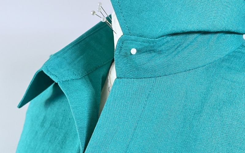 close up of sewn collar and collar stand on shirt neckline