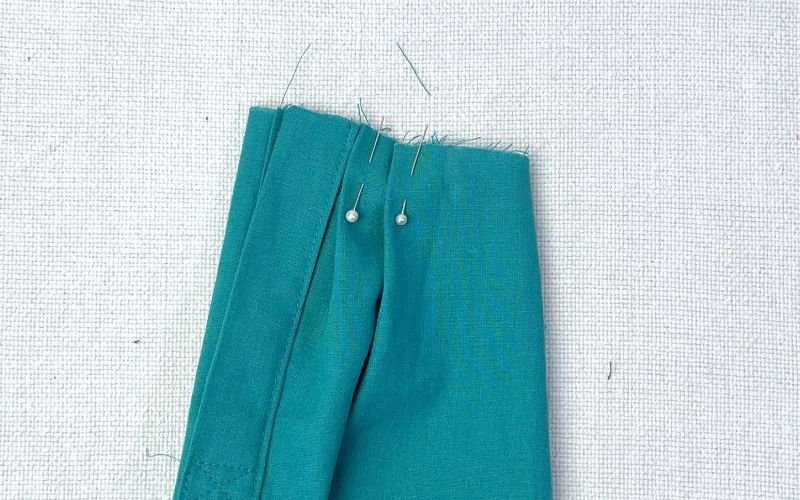 Sleeve placket sewn and pleats folded before attaching cuff