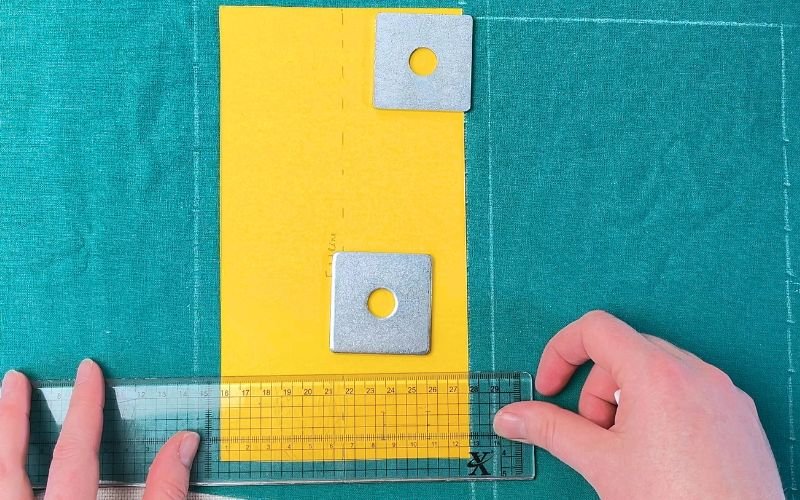 Tracing shirt sleeve cuff pattern onto fabric with straight grain alignment