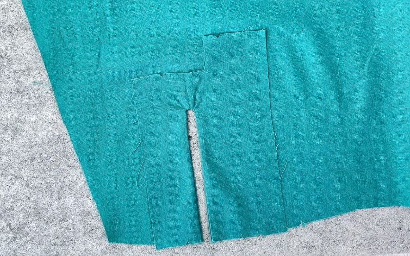 Turned and pressed sleeve placket