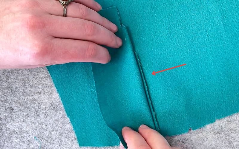 Folding the upper placket over lower placket