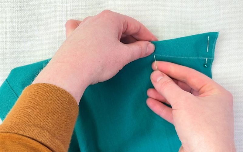 How to Sew Darts on a Shirt: Precise Marking, Transfer and Sewing Tutorial pinning dart along fold line with pins aligned through both dart legs