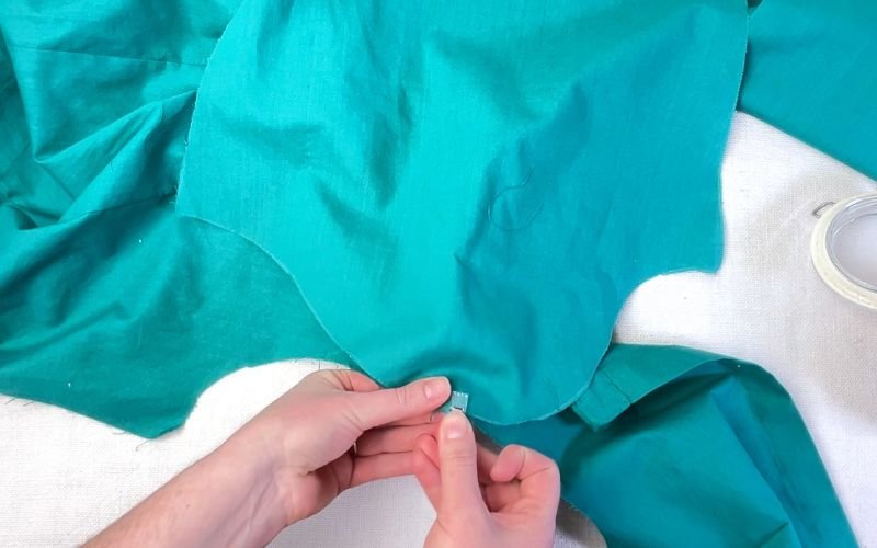 Pinning sleeve crown to shirt bodice at shoulder point