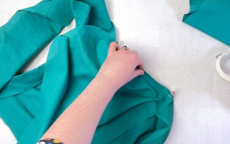 Pinning side seams of shirt bodice and sleeve