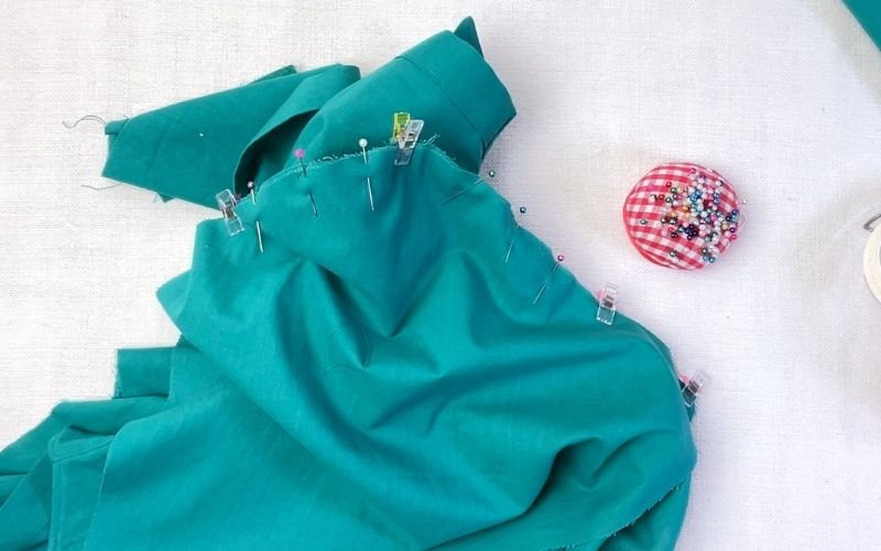 Flat sleeve pinned to shirt bodice