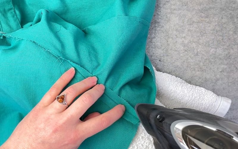 Pressing seam allowance open at sleeve crown